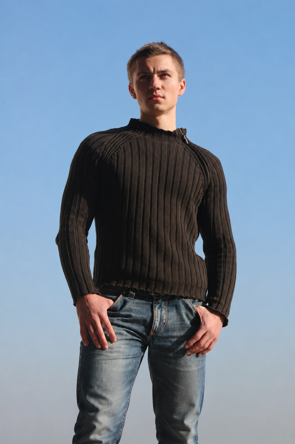 A relaxed sweater worn over straight-leg jeans on an ordinary afternoon
